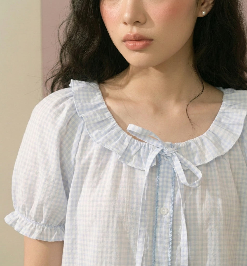 close-up of a woman wearing a blue pajama set